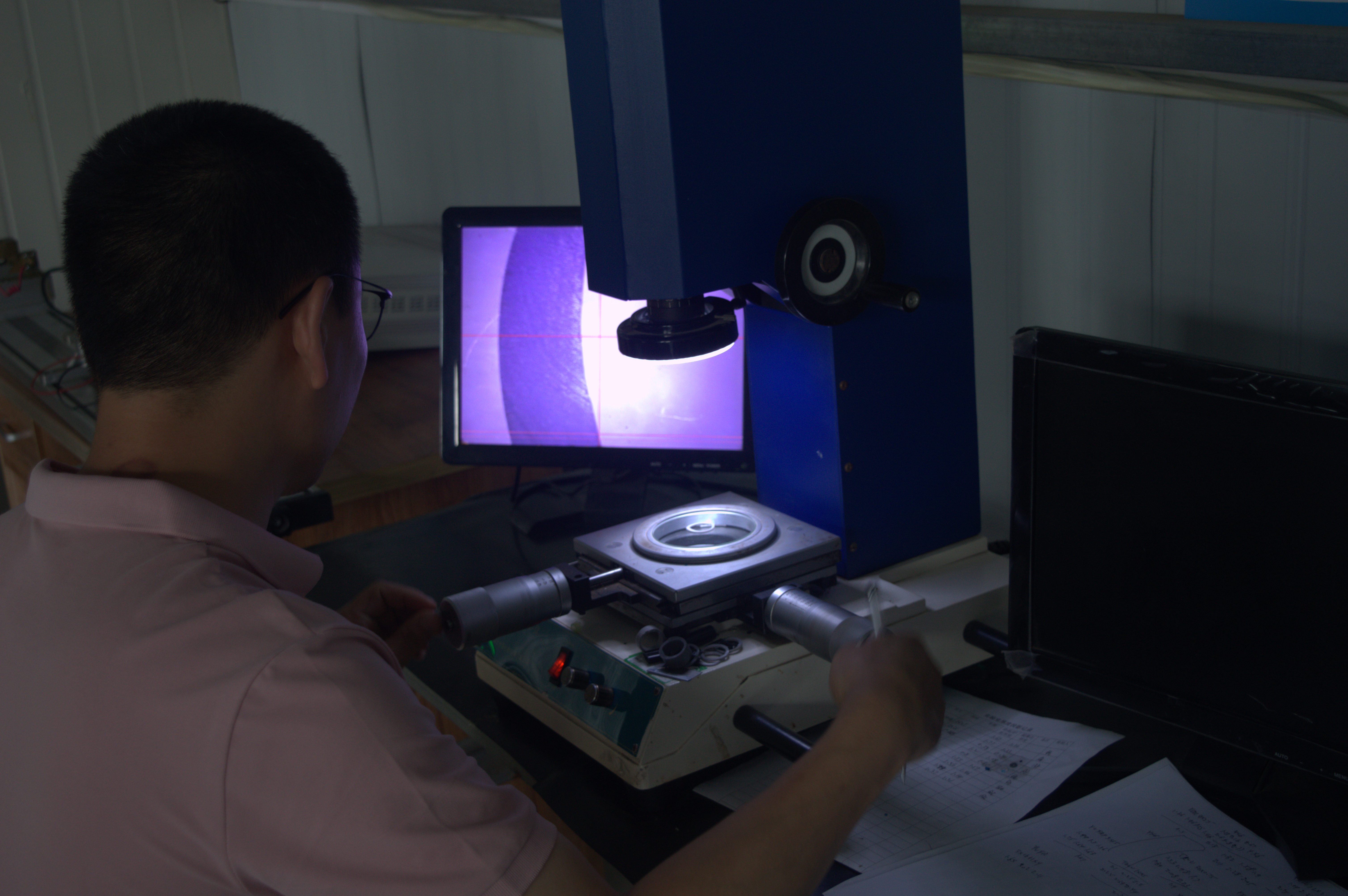 Laboratory operator at inspection equipment
